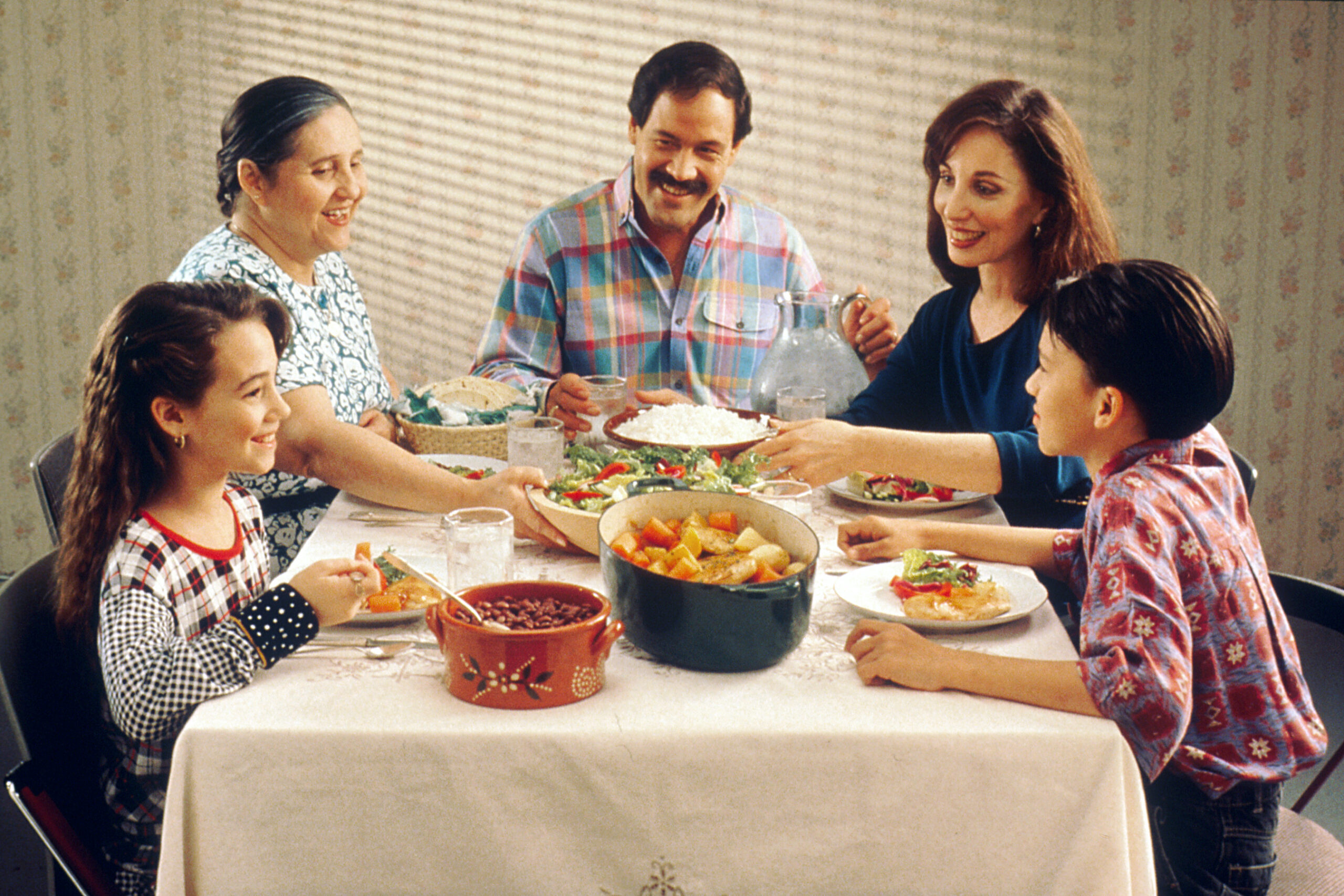 A family meal. In the 2015 study, defining happiness in social terms, such as spending time with family and friends, went with higher well-being in all four regions.