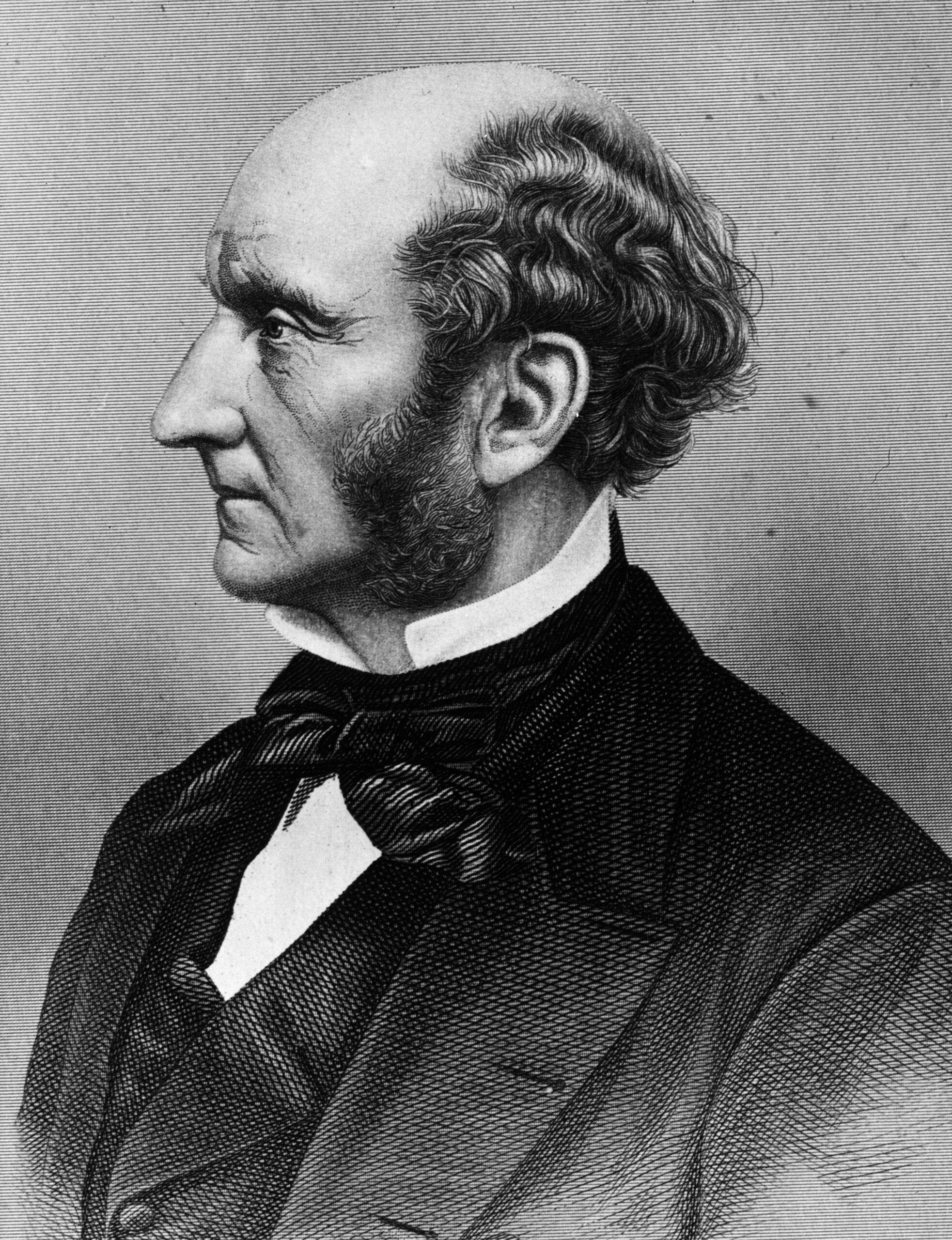 John Stuart Mill, in a photogravure after an 1865 photograph by John Watkins (or John and Charles Watkins).